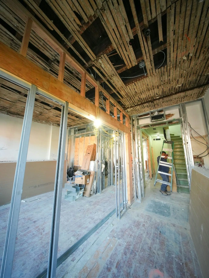 Interior of building under renovation with exposed framing
